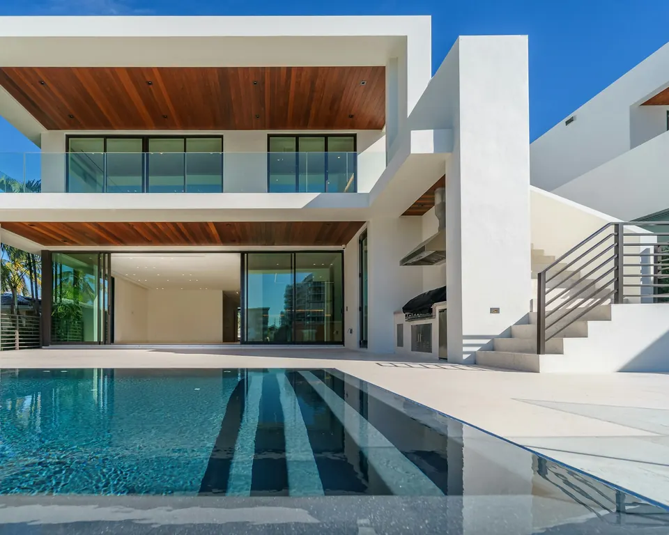 Exterior of a modern white villa with a pool